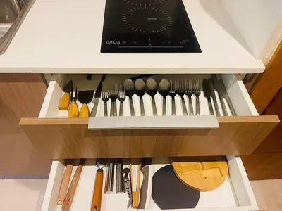 a drawer filled with lots of kitchen utensils at Modern 2 Queen Beds Apartment with Garden View in Puerto Plata