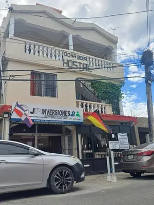 a car parked in front of a building at Dona Beba Guesthouse in La Caleta