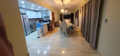 a kitchen and dining room with a table and chairs at Luxury Cabarete East Condominiums in Cabarete