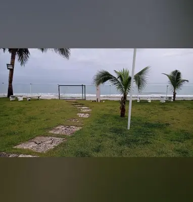 a volley ball hoop and palm trees on the beach at Luxury Cabarete East Condominiums in Cabarete