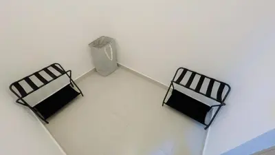 two black chairs and a radiator in a room at Apartamento Armonía-K-204 in Las Terrenas