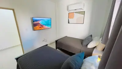 a small room with a bed and a couch at Apartamento Armonía-K-204 in Las Terrenas