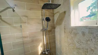 a shower with a glass door in a bathroom at Apartamento Armonía-K-204 in Las Terrenas