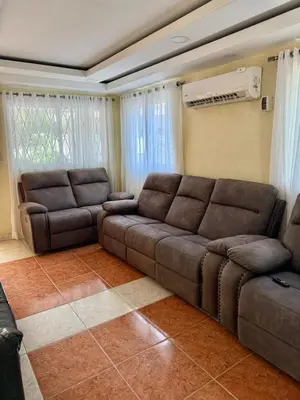 a living room with a couch and two chairs at Charming villa in San Pedro de Macorís