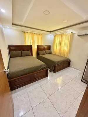 a bedroom with two beds in a room at Villa San Pedro in San Pedro de Macorís