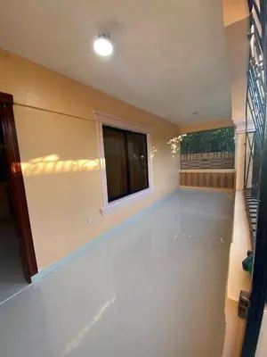 a living room with a window and a white floor at La Ureña House in La Ureña