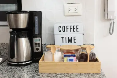 a wooden crate of coffee time on a kitchen counter at Rustic Charm, Apartment in the heart of Santiago in Santiago de los Caballeros