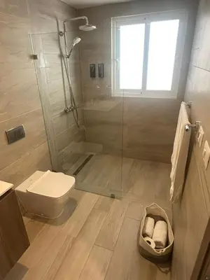 a bathroom with a shower and a toilet and a sink at Escape perfecto, punta cana in Punta Cana