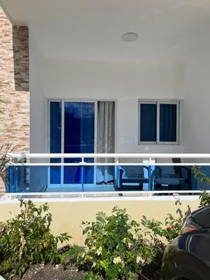 a balcony of a house with blue railing at Residencial Torre del Atlantico in Puerto Plata