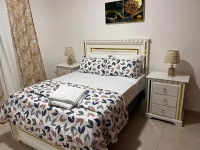 a bedroom with a bed and two night stands at Residencial Torre del Atlantico in Puerto Plata