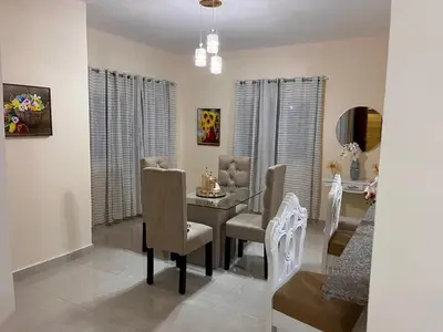 a dining room with a table and chairs at Residencial Torre del Atlantico in Puerto Plata
