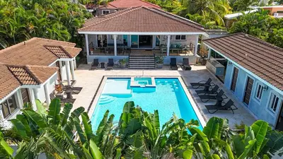 an aerial view of a house with a swimming pool at 6BR, Jacuzzi, Ocean View, Solar Backup Power in Sosúa