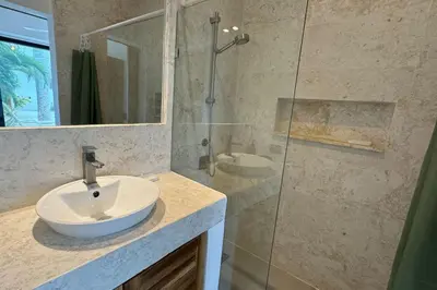 a bathroom with a sink and a glass shower at 5 Bedroom Villa With BBQ and Washer in Las Terrenas