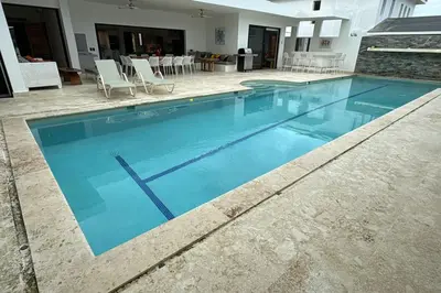 a large swimming pool with blue water at 5 Bedroom Villa With BBQ and Washer in Las Terrenas