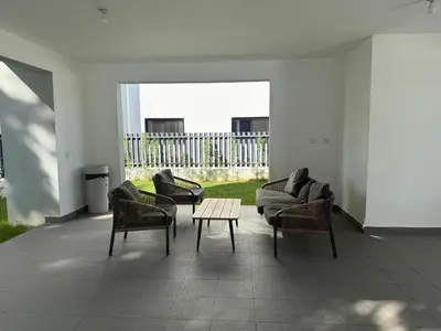 a living room with chairs and a couch and a table at Luxurious Apartment in Santiago de los Caballeros