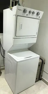 a white stove sitting next to a microwave at Moderna casa cerca del aeropuerto SDQ y de mi rent cars in La Caleta