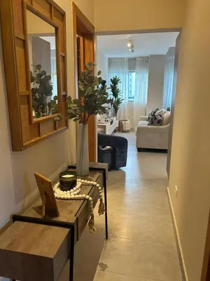 a living room with a table and a couch at REFA - 404 · Luxury 1BR Suite in Piantini | Modern • Pool • Gym in Santo Domingo