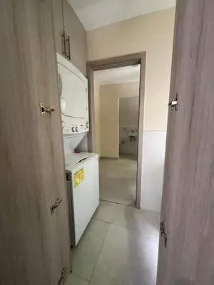a kitchen with a sink and a white refrigerator at Villa Medrano