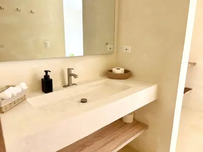 a bathroom with a sink and a mirror at Luxury Family Villa With Pool Near Playa Bonita in Las Terrenas