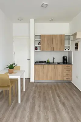 a kitchen with a table and a counter top at La belle planque de Punta Cana- Playa 10 minutos a pie in Punta Cana