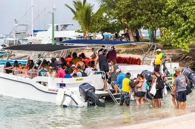 a group of people on a boat in the water at La belle planque de Punta Cana- Playa 10 minutos a pie in Punta Cana
