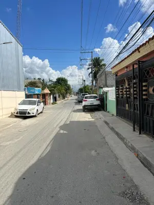 a street with cars parked on the side of the road at Moderna casa seca de aeropuerto SDQ y de mi rent cars in La Caleta