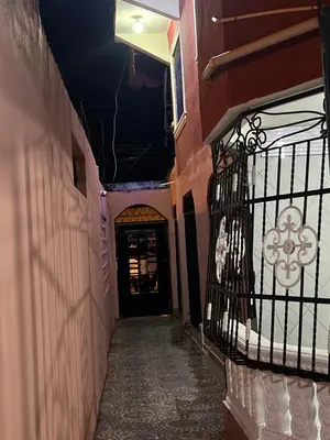 an alley way with a door in a building at Moderna casa seca de aeropuerto SDQ y de mi rent cars in La Caleta