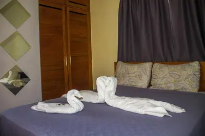 two towels are made to look like animals on a bed at City Sea Exclusive Colonial Gem with Ocean View in Santo Domingo