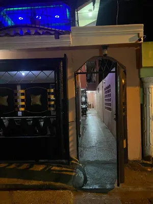 an entrance to a building at night at Moderna casa cerca de el aeropuerto SDQ y mi rent cars in La Caleta