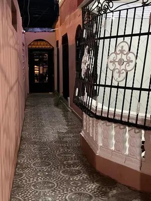 an empty hallway of a building with a gate at Moderna casa cerca de el aeropuerto SDQ y mi rent cars in La Caleta