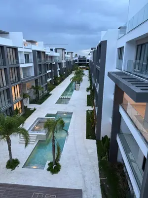 an overhead view of an apartment courtyard with palm trees at Apartamento a estrenar con acceso privado a la playa in Punta Cana