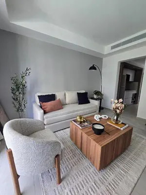 a living room with a couch and a coffee table at Apartamento a estrenar con acceso privado a la playa in Punta Cana