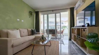 a living room with a couch and a table at Oceanfront Escondido Bay Laguna Beach in Sosúa