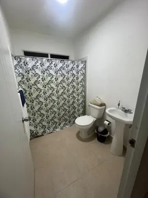 a bathroom with a toilet and a sink at Antares II in San Isidro