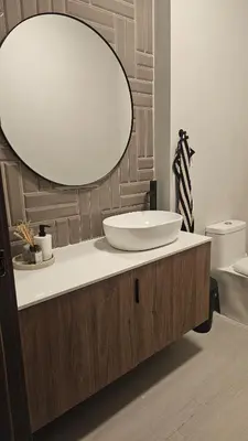 a bathroom with a sink and a large mirror at Luxury 2-Bed Condo in Piantini Sauna, Gym, & Pool in Santo Domingo