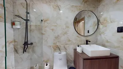 a bathroom with a sink and a mirror at Palmar Apartments Comfort Great Location in Punta Cana