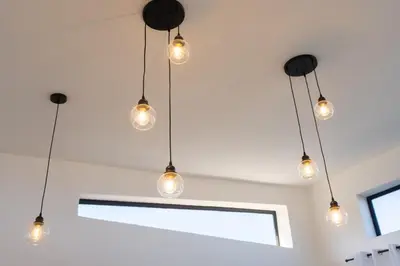 a cluster of lights hanging from a ceiling at Newly Built Luxury Private 3 Bedroom Pool Villa in Sosúa
