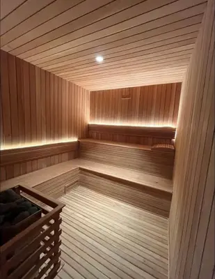 an empty sauna with a wooden at Luxury 2-Bed Condo in Piantini Sauna, Gym, and Pool in Santo Domingo