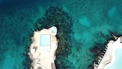 an aerial view of a house on an island in the water at Luxury apartment Tracadero 2 Bedrooms Sea Pools access Private Garden Workspace in La Laguna