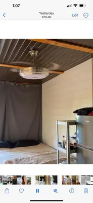 a room with a bed with a tent in it at Devon Rodriguez art villa in El Naranjito