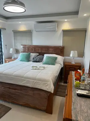 a bedroom with a large bed and a table at Villa M & M in Guerra
