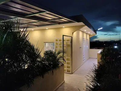 a building with a door on the side of it at Nice rooftop apartment in La Cabirma