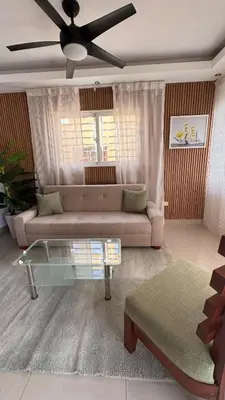 a living room with a couch and a glass table at Coastal Apt, Near Malecón, 6 Guests 3 beds in La Romana