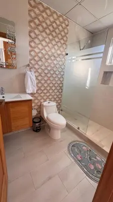 a bathroom with a toilet and a shower at Coastal Apt, Near Malecón, 6 Guests 3 beds in La Romana