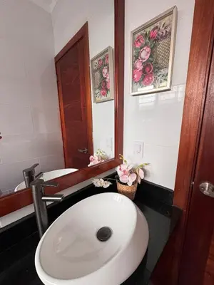 a bathroom with a white toilet and a sink at Luxury Caribbean Oasis, Private Pool & BBQ, 8 Guest in La Romana