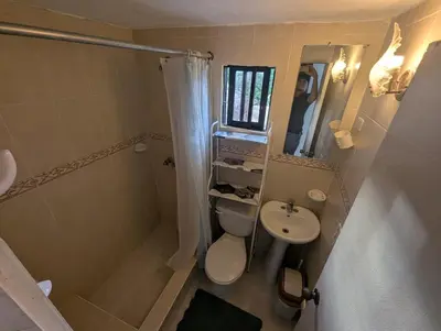 a small bathroom with a toilet and a sink at small apartment in a downtown area in Cruce de Veragua