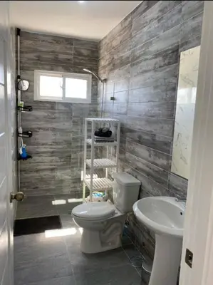 a bathroom with a toilet and a sink at Fully furnished 2 bedroom appart in Bayahibe