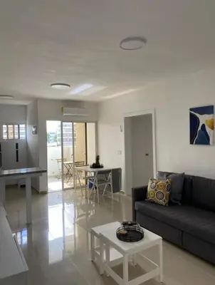 a living room with a couch and a table at Fully furnished 2 bedroom appart in Bayahibe