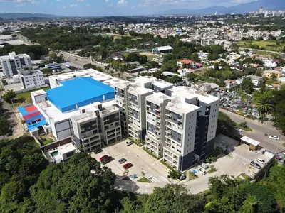 an overhead view of a building in a city at 3BR Condo by the Airport Pool Gym Parking Security in Santiago de los Caballeros