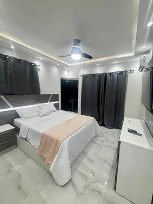 a bedroom with a bed and a ceiling fan at villa la pal de 4 in La Ureña